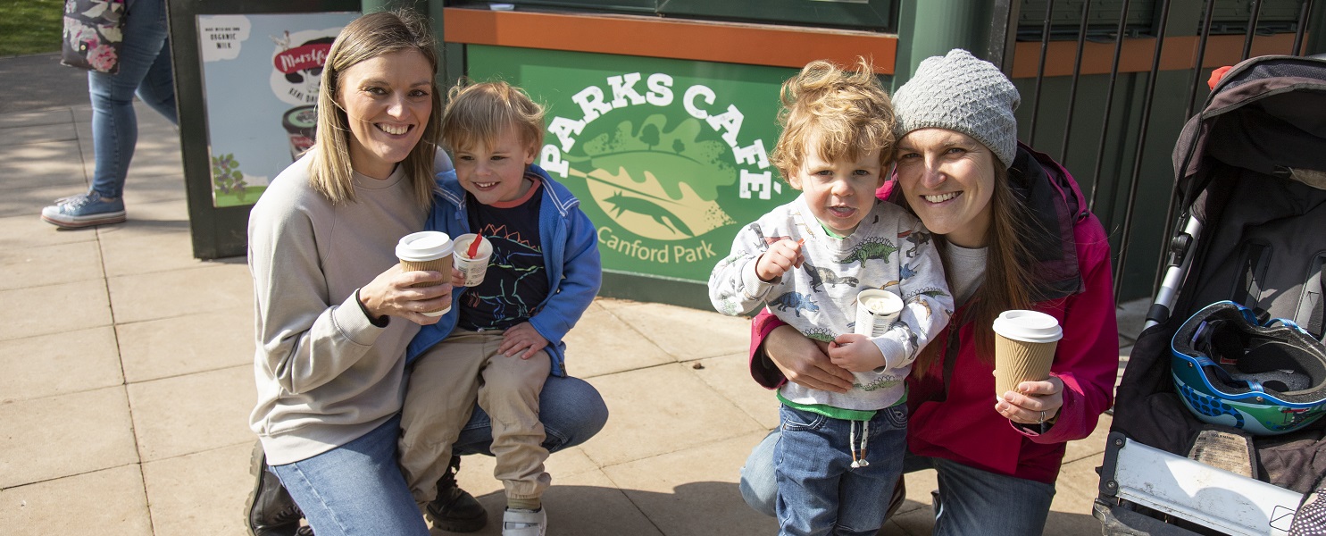 Two women and two children outside Canford Park cafe