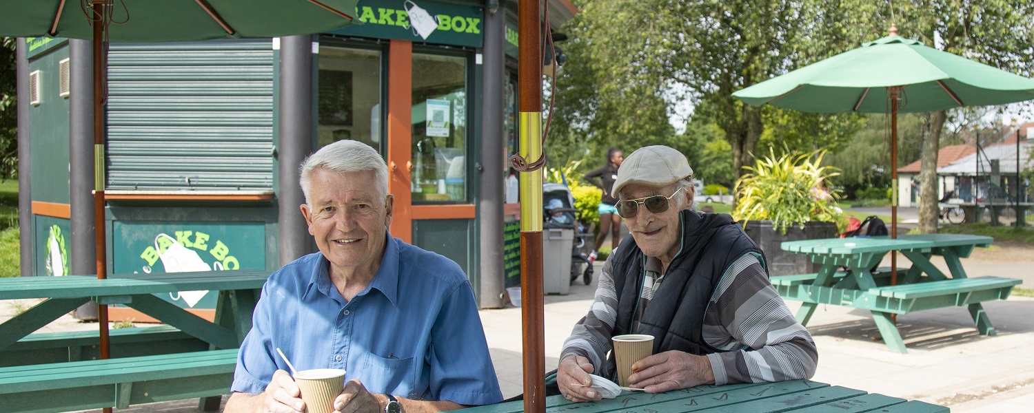 Two customers sitting outside The Bake Box