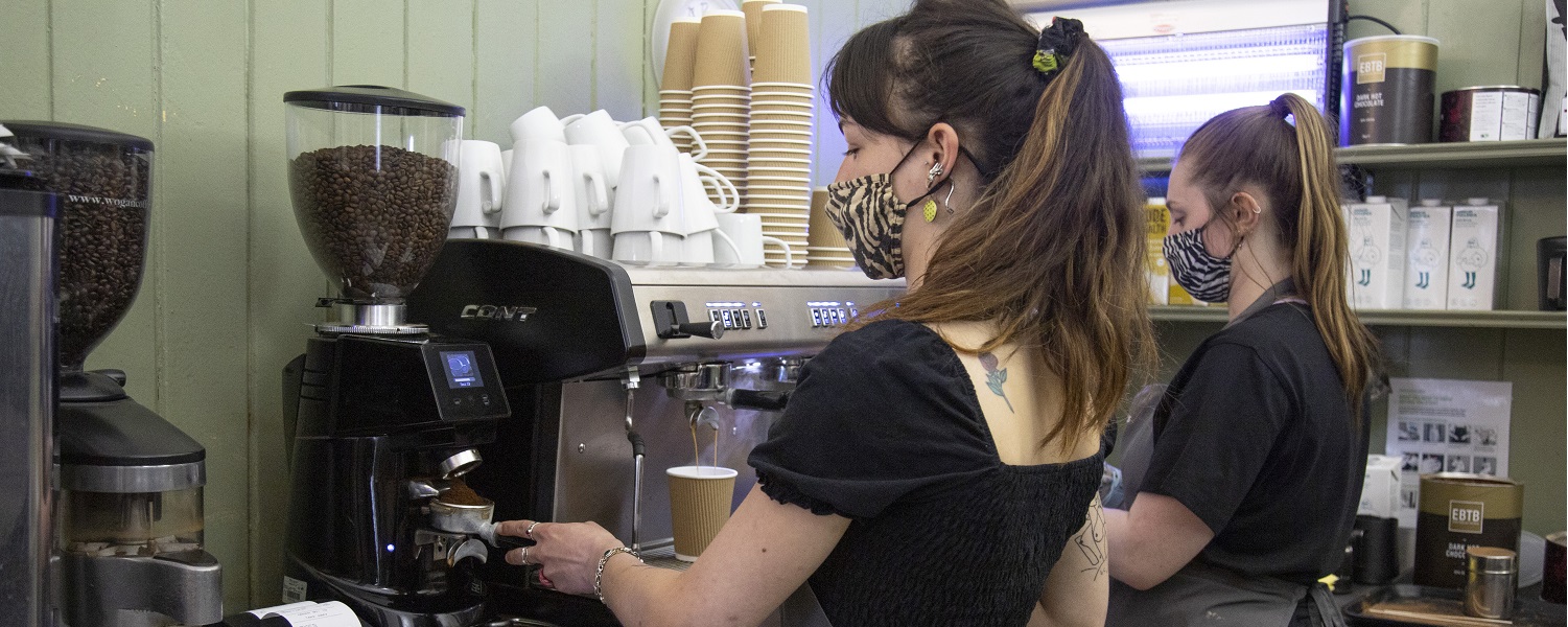 Members of staff making coffee