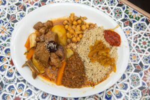 A plate of meat, rice and beans