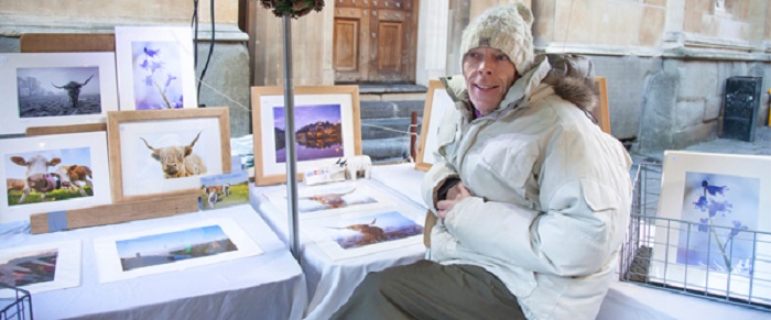 A man selling photos